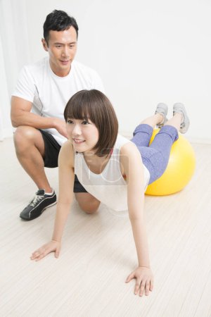 Photo for Fitness and health concept. portrait of young japanese man and woman training together - Royalty Free Image
