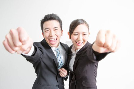 Photo for Business team with fists up in office - Royalty Free Image