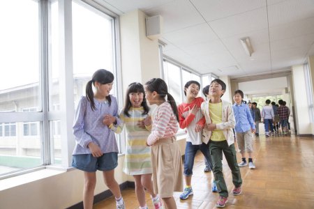Photo for Portrait of asian children in school corridor - Royalty Free Image