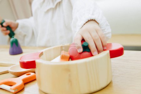 Photo for Child playing with colorful wooden toys - Royalty Free Image