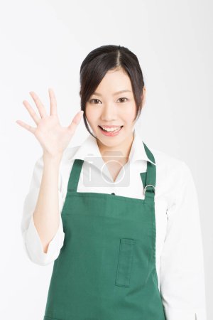 Photo for Portrait of asian woman chef showing palm - Royalty Free Image