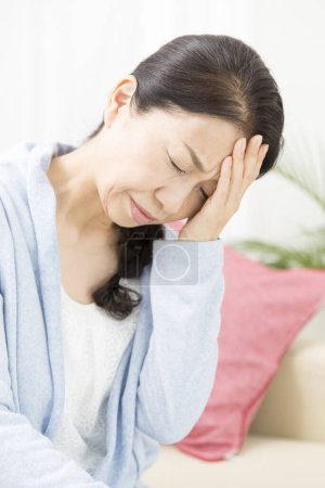 Photo for Senior woman having headache at home - Royalty Free Image
