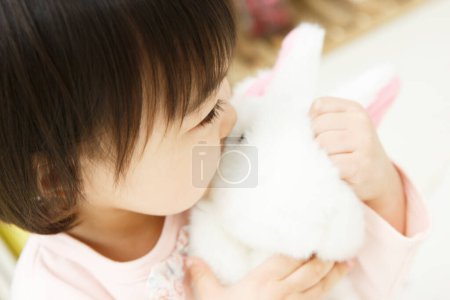 Photo for Little asian child playing with toy - Royalty Free Image