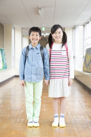 Photo for Portrait of asian children in school corridor - Royalty Free Image