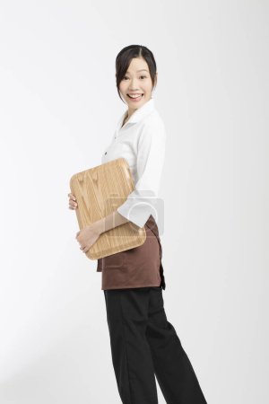 Photo for Portrait of japanese woman holding tray - Royalty Free Image