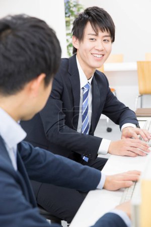 Photo for Businessmen  working on computers in office - Royalty Free Image