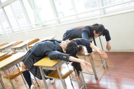 Photo for Asian students having fun in classroom - Royalty Free Image