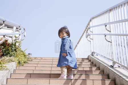 Photo for Portrait of cute Japanese child outdoors - Royalty Free Image