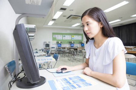 Photo for Asian woman studying with computer at driving school - Royalty Free Image