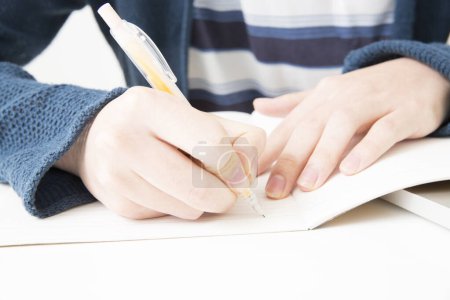 Photo for Man drawing on a notebook, close - up on hands - Royalty Free Image
