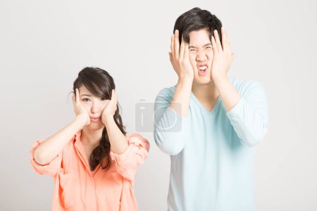 Photo for Asian woman and man making funny facial expressions - Royalty Free Image
