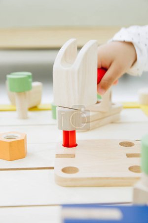 Photo for Child playing with colorful wooden toys - Royalty Free Image