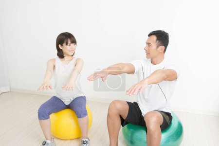 Photo for Fitness and health concept. portrait of young japanese man and woman training together - Royalty Free Image