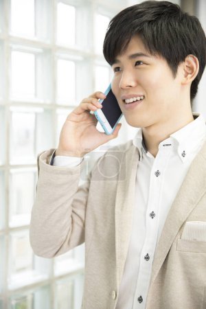 Photo for Portrait of a businessman talking on cellphone - Royalty Free Image