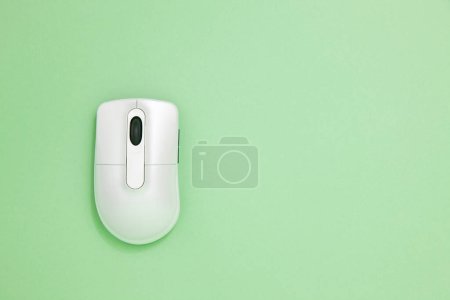 Photo for Wireless computer mouse on green background - Royalty Free Image