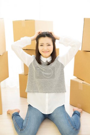 Photo for Beautiful Japanese woman with cardboard boxes - Royalty Free Image
