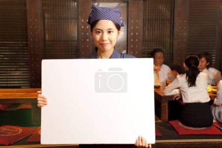 Photo for Young woman with blank menu - Royalty Free Image