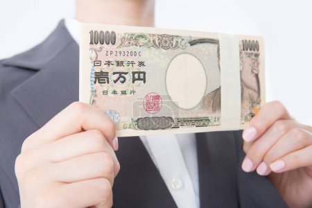 Téléchargez les photos : Homme d'affaires avec devise yen - en image libre de droit
