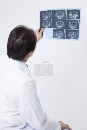 Photo for Male doctor holding mri scan - Royalty Free Image