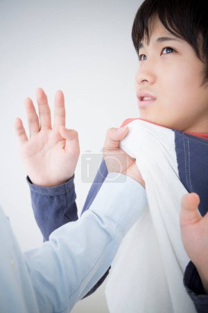 Photo for Asian father punishing son. Home abuse concept - Royalty Free Image