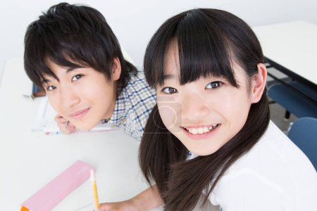 Photo for Portrait of Japanese girl and boy studying in school - Royalty Free Image