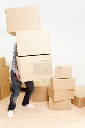 Photo for Man carrying cardboard boxes - Royalty Free Image
