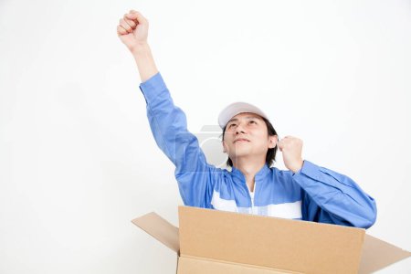 Photo for Young man with cardboard box - Royalty Free Image