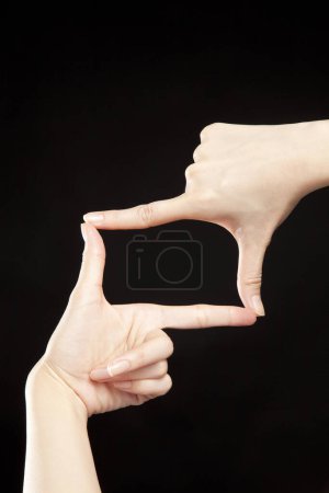 Foto de Gesto de dos manos sobre negro - Imagen libre de derechos