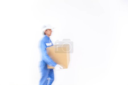 Photo for Young Japanese delivery man with cardboard box - Royalty Free Image