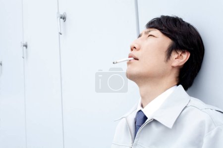 Photo for Asian man smoking the cigarette - Royalty Free Image