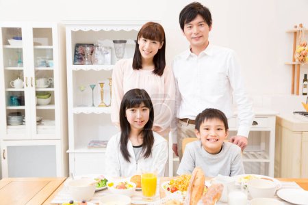 Photo for Portrait of happy Japanese family at home - Royalty Free Image