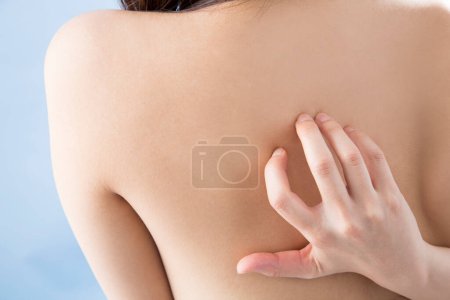 Photo for Close up of woman touching her back - Royalty Free Image