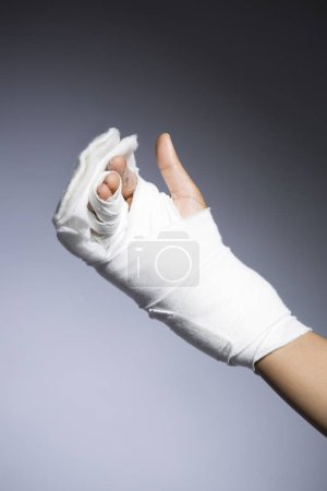 Photo for Female hand bandage on grey background, close up view - Royalty Free Image
