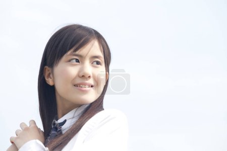 Photo for Beautiful japanese schoolgirl during summer day - Royalty Free Image