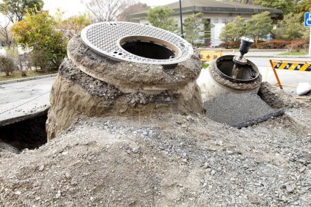 Photo for Manhole that popped out due to liquefaction during an earthquake - Royalty Free Image