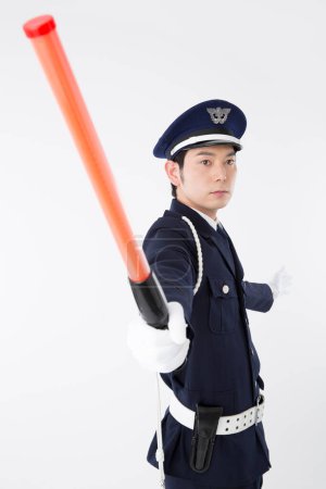 Foto de Retrato de estudio del oficial de policía japonés en uniforme - Imagen libre de derechos