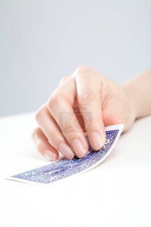 Photo for Close up of female hand holding a card - Royalty Free Image
