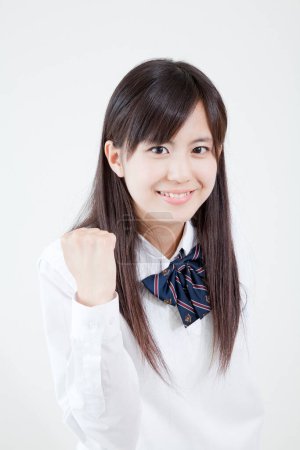 Téléchargez les photos : Portrait studio de jeune fille japonaise en uniforme scolaire - en image libre de droit