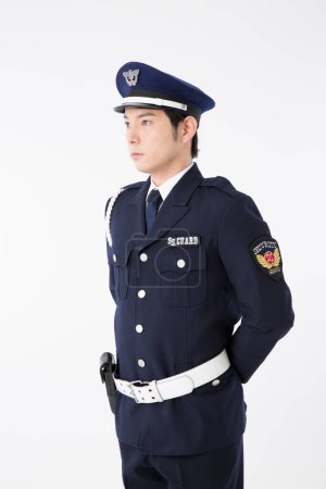 Photo for Studio portrait of Japanese police officer in uniform - Royalty Free Image