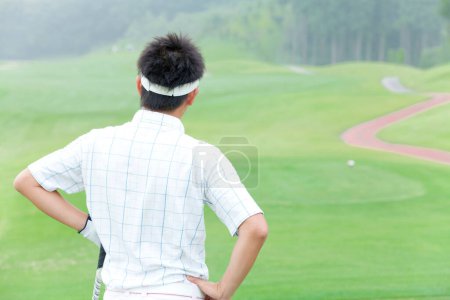 Téléchargez les photos : Portrait de asiatique joueur de golf - en image libre de droit