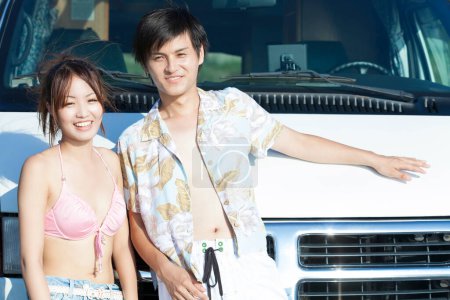 Photo for Young asian couple standing by van - Royalty Free Image