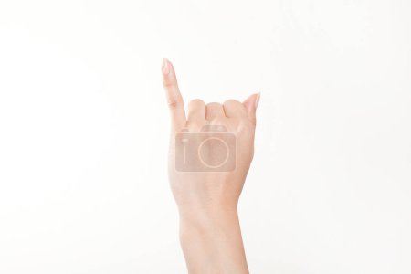 Foto de Primer plano de la mano femenina gesticulando sobre fondo blanco - Imagen libre de derechos