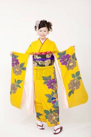 Photo for Portrait of a young girl in  kimono isolated - Royalty Free Image