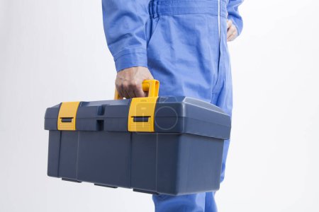 male builder in protective uniform with tools