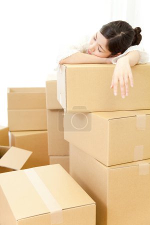 Photo for Young asian woman moving into new house - Royalty Free Image