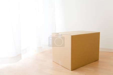 Photo for Cardboard box on the floor. - Royalty Free Image
