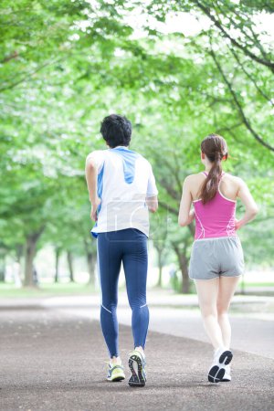 Photo for Young couple  running in city park - Royalty Free Image