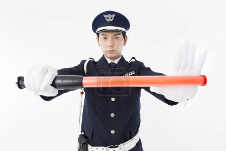 Photo for Studio portrait of Japanese police officer in uniform - Royalty Free Image