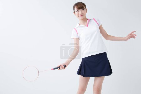 Photo for Smiling Japanese woman with badminton racket - Royalty Free Image