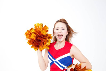 Photo for Beauty Japanese cheerleader dancing at studio. Closeup portrait of beauty young woman lifting pom poms - Royalty Free Image